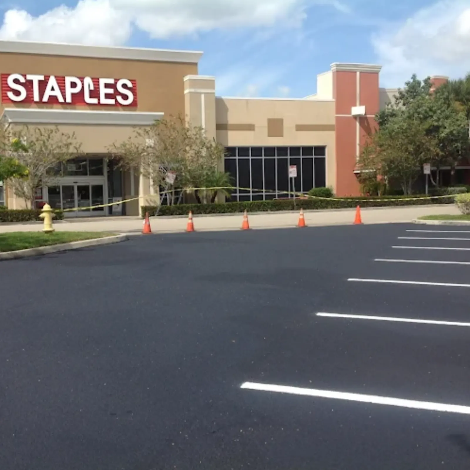 Freshly sealcoated and striped retail shopping center parking lot