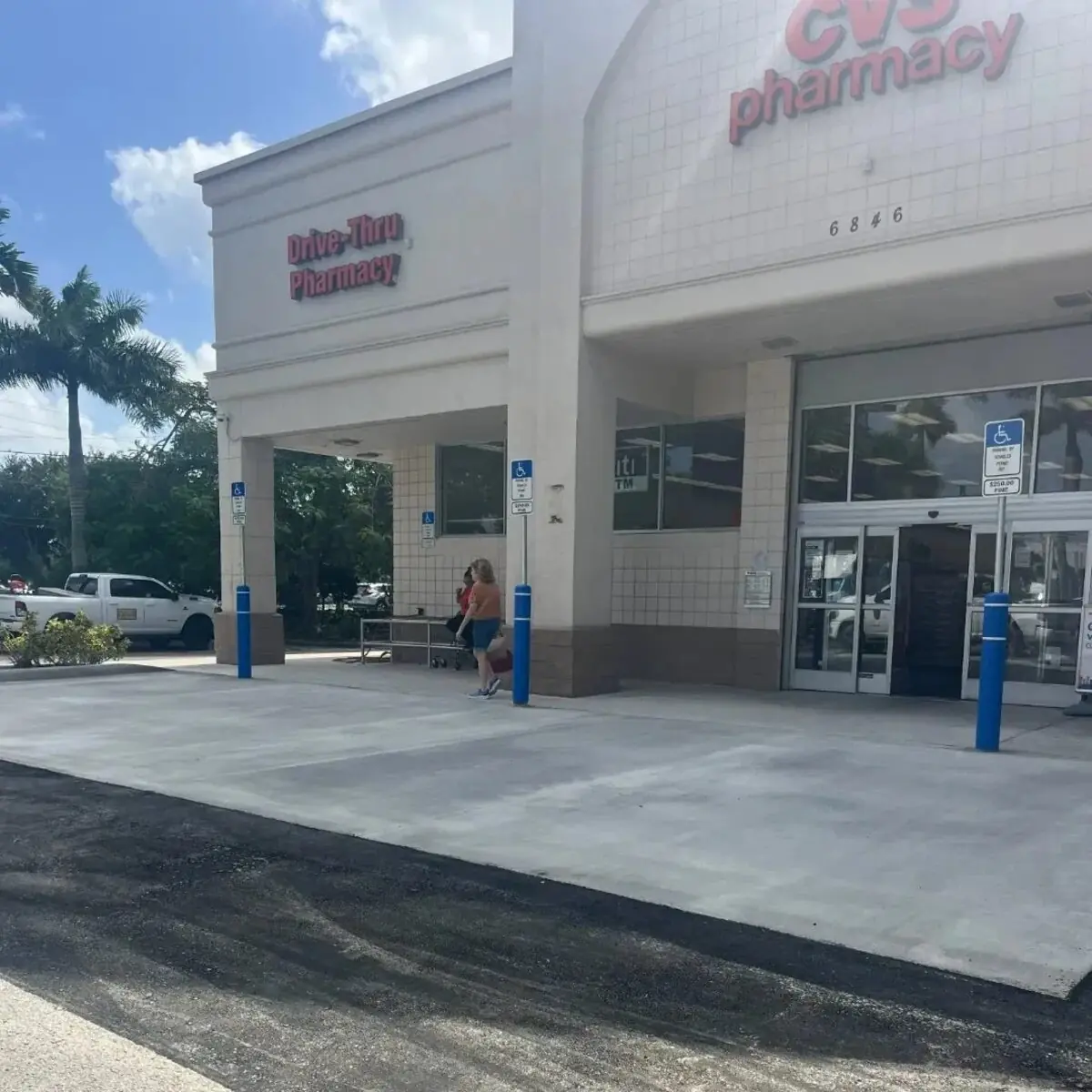 Fresh asphalt paving work at a CVS Pharmacy storefront in Southwest Florida by Florida Sealcoat and Striping