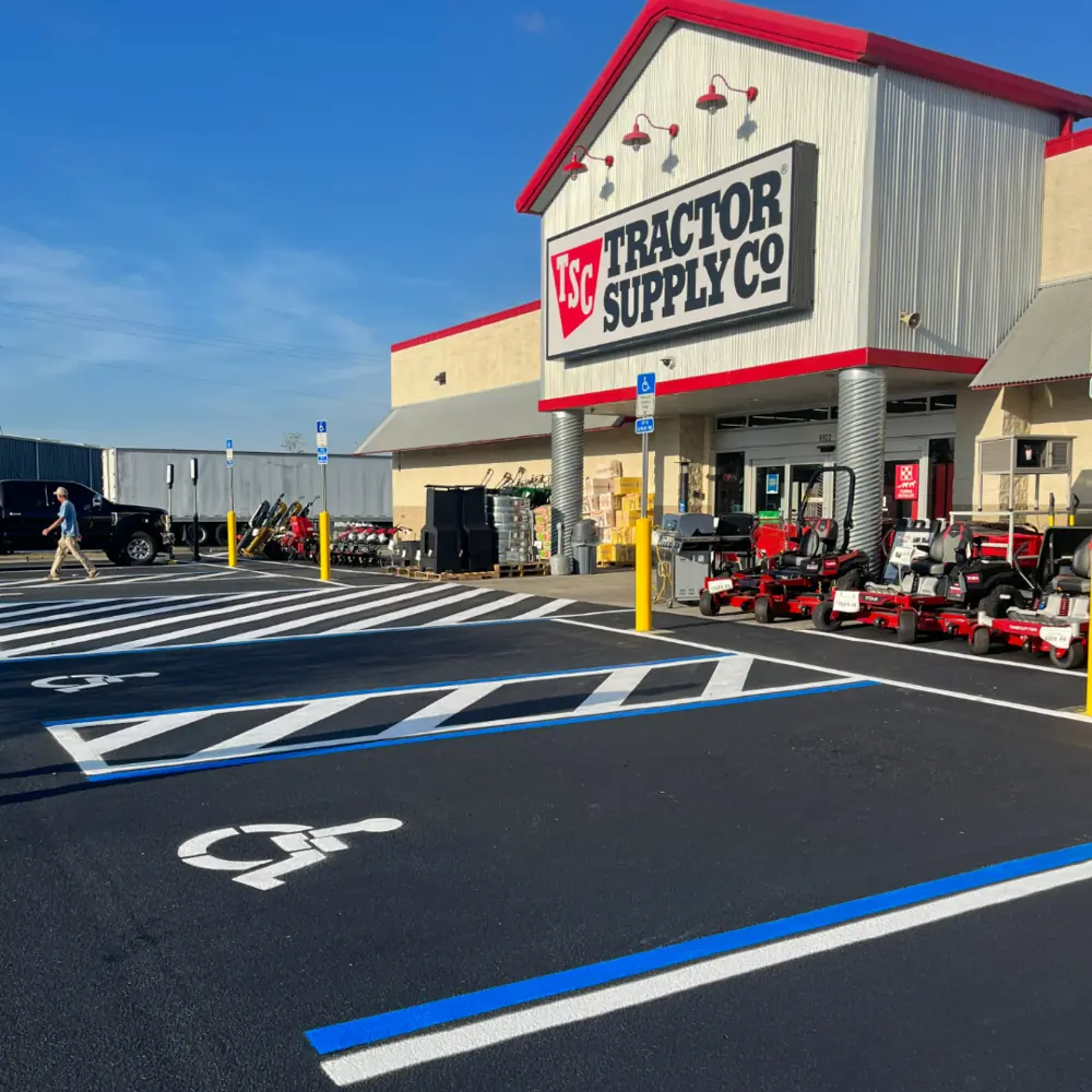 Freshly sealcoated and striped Tractor Supply Co parking lot with ADA accessible stalls in Southwest Florida